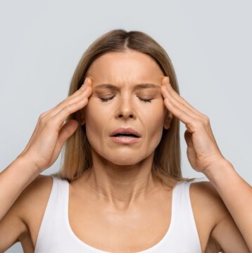 Blonde middle aged woman with closed eyes