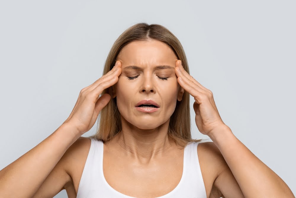 Blonde middle aged woman with closed eyes