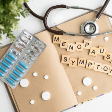 A note book with the words Menopause Symptoms