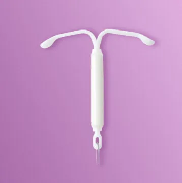 Image of a Mirena Contraceptive Coil on a purple background