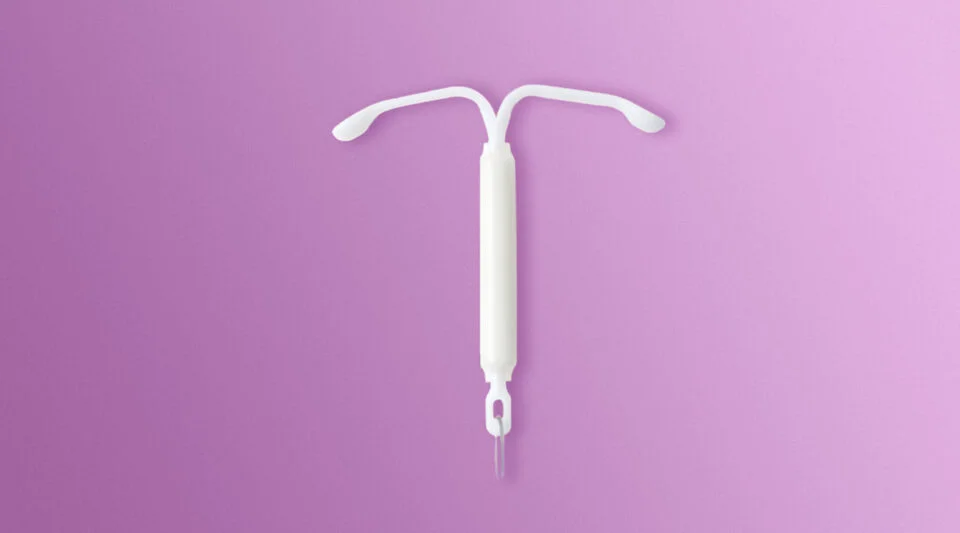 Image of a Mirena Contraceptive Coil on a purple background