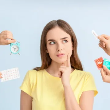 Thoughtful young woman considering different means of contraception